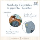 „Kuschelige Materialien in geprüfter Qualität.“ Bilder von Elefant und Affe. Text: „Speichelecht“ und „Im Labor auf Schadstoffe geprüft“. Logo: Cosy Books.