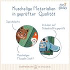 "Kuschelige Materialien in geprüfter Qualität. Speichelrecht, Im Labor auf Schadstoffe geprüft, Kuscheliger Musselin Stoff." Illustration mit Tiermotiven.