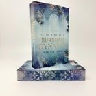 "Julie Marinello, Burnham Dynasty, Weil wir es sind, Roman." Ein Buch mit blauem Cover, goldenen Akzenten und Blumendekor.