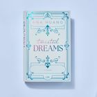 Texte: "ANA HUANG", "twisted DREAMS", "ROMAN", "LYX". Ein elegantes, geometrisches Design in blauen Verzierungen.