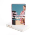 Buchcover mit dem Text: "inga hanka little hollywood roman". Frau in rosa Jacke und buntem Rock vor blauem Himmel.