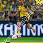 "Felix Nmecha", "#8 / MITTELFELD", "April 2026", "Vorausabildung". Sportler in schwarz-gelbem Trikot läuft mit Ball. BVB-Logo oben.