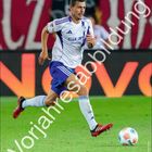 "Ron Schallenberg", "Vorjahresabbildung", "SUN". Fußballspieler in Aktion. Schalke Logo unten links. "April" unten rechts.