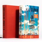 M. L. Stedman, "Ein weites Leben", Roman. Buchcover zeigt blauen Himmel mit Wolken und Spiegel-Bestsellerhinweis.