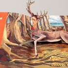 Text: "Der verwundete Hirsch." 

Ein Pop-up zeigt einen Hirsch mit Pfeilen und einem Frauenkopf, in einem bewaldeten Hintergrund.