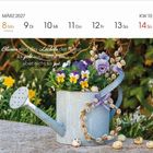 "Blumen sind das Lächeln der Natur. Es geht auch ohne sie, aber nicht so gut. Max Reger." 
Gießkanne mit Blumen.