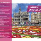 "Nicht verpassen", "Brüssel entdecken". Eine prächtige Platzansicht mit kunstvoll angelegtem Blumenteppich und historischen Gebäuden.