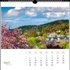 April-Kalender mit Foto: Blühender Baum und hügelige Landschaft mit Dörfern im Hintergrund.