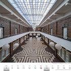 Ehemalige Lohnhalle der Grube Carolus Magnus in Übach-Palenberg, Februar 2027. Helle Decke, Musterboden, Papierlampen.