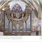 Basilika St. Ulrich und Afra in Augsburg, detailreiche Orgel mit filigranen Verzierungen und Malereien, Kalenderanzeige rechts.