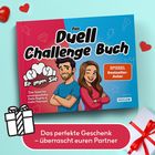 „Das Duell Challenge Buch: Er gegen Sie“. „Das perfekte Geschenk – überrascht euren Partner.“ Zwei gezeichnete Figuren.