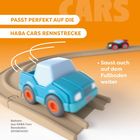 Text: "Passt perfekt auf die HABA Cars Rennstrecke. Saust auch auf dem Fußboden weiter." Spielzeugautos auf einer Bahn.