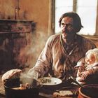 Ein Mann in abgenutztem Hemd hält ein Baby. Auf dem Tisch stehen Brot, Flasche und dampfender Eintopf.