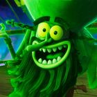 Ich kann keinen Text im Bild erkennen. Eine grün leuchtende, fröhliche Figur mit breitem Grinsen und gelben Augen auf einem Boot.