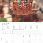 9 • 2027. Kalender mit Wochen- und Tagesangaben. oben Foto: Pflanze in rostiger Krone.