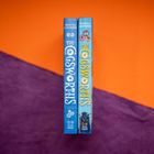 "The COGSWORKS" auf zwei blauen Büchern, Autoren "Tristan Tales & Luke Pounder". Hintergrund orange und lila diagonal geteilt.