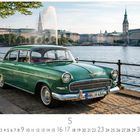 Opel Kapitän, Monatsübersicht mit Tagen 1 bis 31 und Zahl 5. Grünes, klassisches Auto vor einem Gewässer und architektonischer Kulisse.