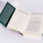 Offenes Buch mit Kapitelüberschrift „Du bist der Herrscher“ und Fließtext auf weißem Papier.