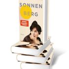 "SONNENBERG" von Brigitte Glaser, "SPIEGEL Bestseller-Autorin", zeigt eine Frau im Profil, vor einem gelben Kreis.