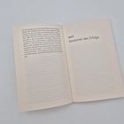 Links steht ein Textabschnitt, rechts der Titel "Teil II: Anatomie des Erfolgs" auf einer offenen Buchseite.