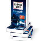 Ein Buch mit dem Titel "Rauhnacht" von Klüpfel Kobr steht aufrecht; daneben liegt es geöffnet.