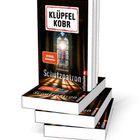 Zwei Bücher; eines steht aufrecht mit dem Titel "Klüpfel Kobr Schutzpatron", das andere ist geöffnet und liegt flach.