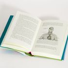 Ein Buch ist aufgeschlagen auf Seite 200–201. Rechts eine Medizingrafik des Blutkreislaufs mit Beschriftungen.