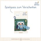 „Spielspaß zum Verschenken“, „Mit weichen Greif-Laschen“, „Cosi Books“. Eulenabbildung auf einem weichen Buchspielzeug.