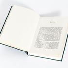 Der offene Buchtext beginnt mit „Tonio Kröger.“ Danach folgt der Textfluss in Blocksatz auf der rechten Seite.