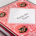 "George Orwell, Farm der Tiere" auf rotem Buchcover mit Schweineillustrationen und weißen Verzierungen.
