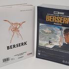 Buchcover "BERSERK" und Puzzlebox. Illustration: Stadt, Krieger und mystische Figur. Enthält 500 Teile.