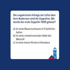 "Wo wurde der erste Zeppelin 1899 gebaut?" Drei Antwortmöglichkeiten a bis c. Segelboot und Leuchtturm als Illustration.