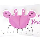 Text: "eine Krabbe". Illustration einer rosa Krabbe mit großen Augen und dünnen Beinen in einem aufklappbaren Buch.