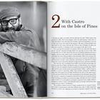 "2 With Castro on the Isle of Pines" steht groß geschrieben. Links lächelt ein Mann mit Bart und Brille an einem Geländer.