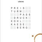 "LÖSUNG" steht oben. Ein Wortgitter mit Wörtern: PREIS, TURM, PASS, DRUCK, KOHL, KAESE, BERG. Kaffee-Ring unten rechts.