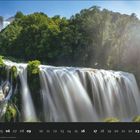 Kalender mit Datum 05 und hervorgehobenen Tagen von 16 bis 23 vor einem großen Wasserfall in bewaldeter Umgebung.
