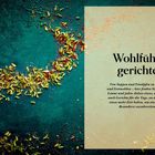 "Wohlfühlgerichte. Von Suppen und Eintöpfen zu Currys und Festmahlen..." steht auf der rechten Seite. Links Kräuter auf einem grünen Hintergrund.