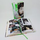 "Rea Garvey Before I Met Supergirl" steht auf einem Buchcover mit einer teils bunten Illustration, daneben ein geöffnetes Buch mit Fotos.