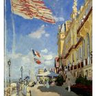 05. Gartenterrasse. Zwei große Flaggen. Menschen spazieren. Eindruck eines sonnigen Tages an der Küste.