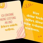 Zwei Karten mit Sprüchen: "Ich erkenne meine Leistung an und feiere mich selbst." "Was deine Seele nährt, lässt deine Träume wachsen."