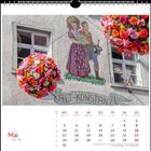 ALT-KONSTANZ. Illustration eines Paares in traditioneller Kleidung auf einer Hauswand. Blumenkugeln und Kalender für Mai.