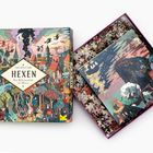 "Die Welt der Hexen", 1000 Teile. Illustration mit Hexen, Burgen und Bäumen in lebhaften Farben. Puzzle-Box und Teile sichtbar.