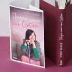 "Fliegen wäre eine Option" von Steffi Tauber. Buchcover zeigt eine lächelnde Frau mit einem Gehstock.