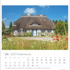 05 | 2027 Rügen Meine Insel. Kalender mit einem Reetdachhaus und Blumengarten unter blauem Himmel. EILAND Logo.