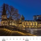Kalendertext: Februar | März 2027, Woche 8 und 9. Bild zeigt den Burgplatz in Essen bei Nacht, beleuchtete Kirche und modernes Gebäude.