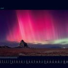 06 Juni Kalenderseite, zeigt einen Berg vor einem Himmel voller pinker und grüner Polarlichter.
