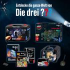 Text: "Entdecke die ganze Welt von Die drei ???" 
Zu sehen sind Produkte wie ein Detektiv-Koffer und Puzzle.