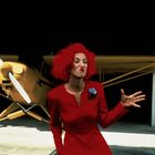 Eine Frau mit rotem Haar und rotem Kleid steht vor einem gelben Flugzeug, macht eine Grimasse und gestikuliert.