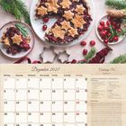 Dezember 2027 Kalender und Cranberry-Pie Rezept. Bild zeigt einen Pie mit sternförmiger Kruste und weihnachtlicher Dekoration.