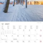 12 · 2027 Kalender, Monatstage Montag bis Sonntag, mit Feiertagen markiert. Oben verschneite Bäume bei Sonnenaufgang.
